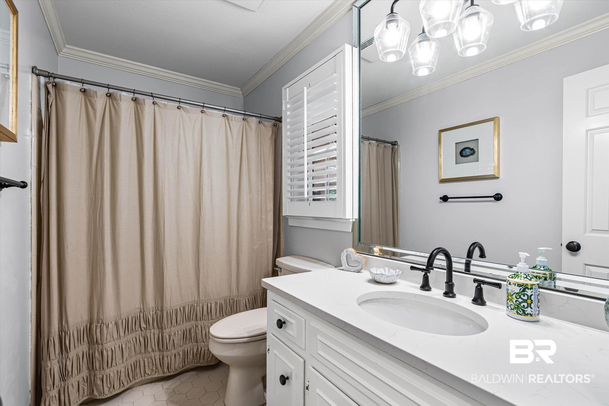 4776 Falls Church Road Mobile, AL 36608 - Photo 19 of 45 Bathroom featuring a white vanity with an undermount sink, black fixtures, and a large mirror