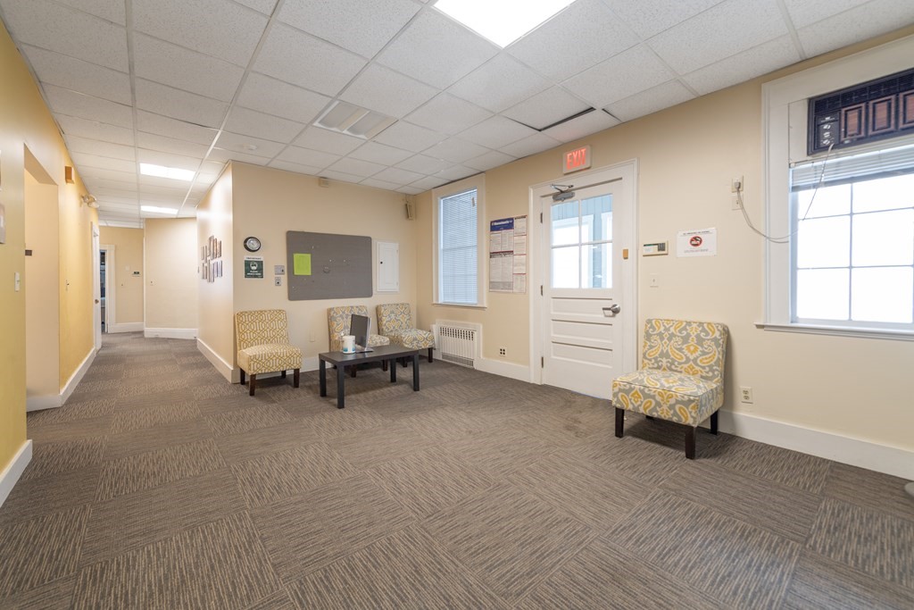 5 Phillips Place Cambridge, MA 02138 - Photo 2 of 8 a living room with furniture and windows