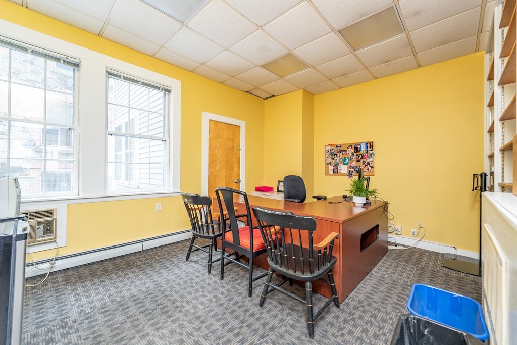 5 Phillips Place Cambridge, MA 02138 - Photo 3 of 8 a view of a dining room with furniture and a window