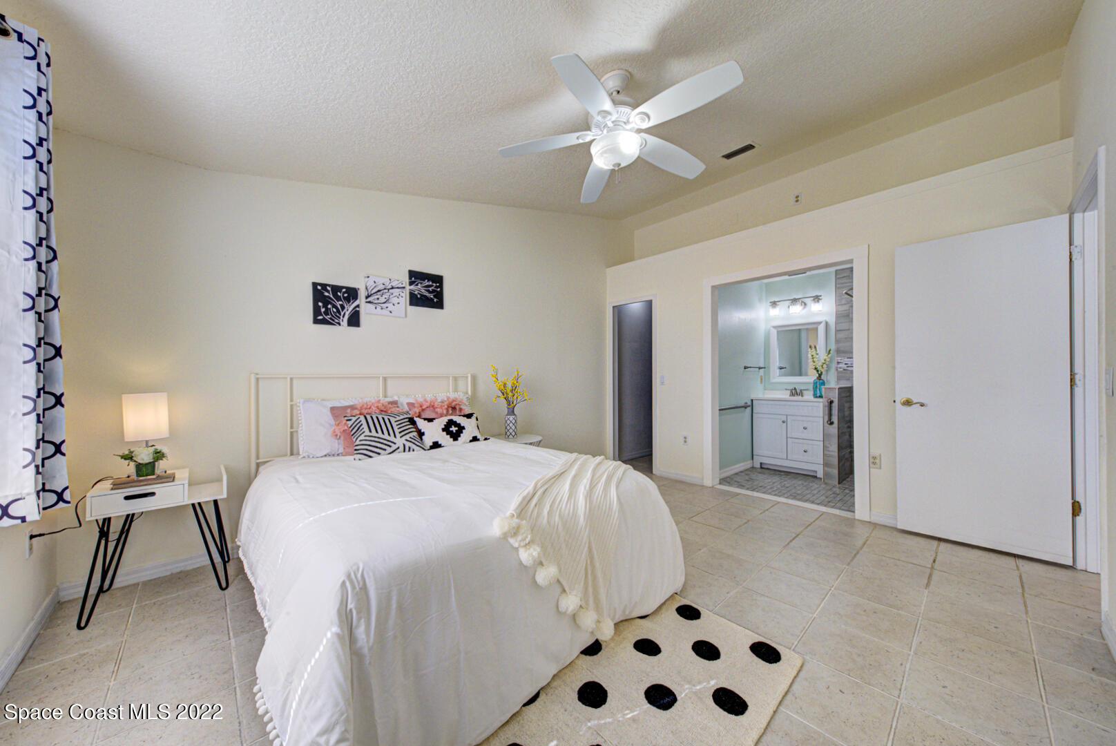6820 Cairo Road Cocoa, FL 32927 - Photo 12 of 28 master bedroom with ensuite