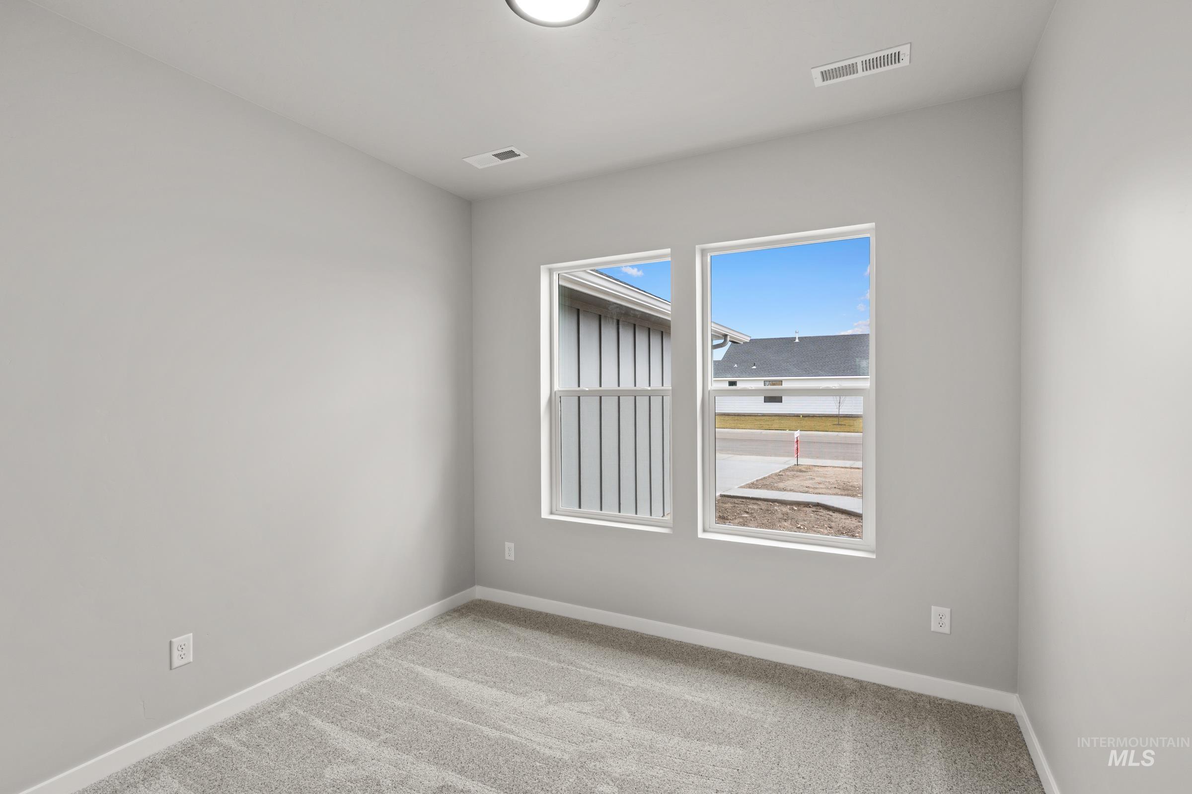 487 Hamlow Avenue Middleton, ID 83644 - Photo 17 of 19 Spare room with light carpet and baseboards