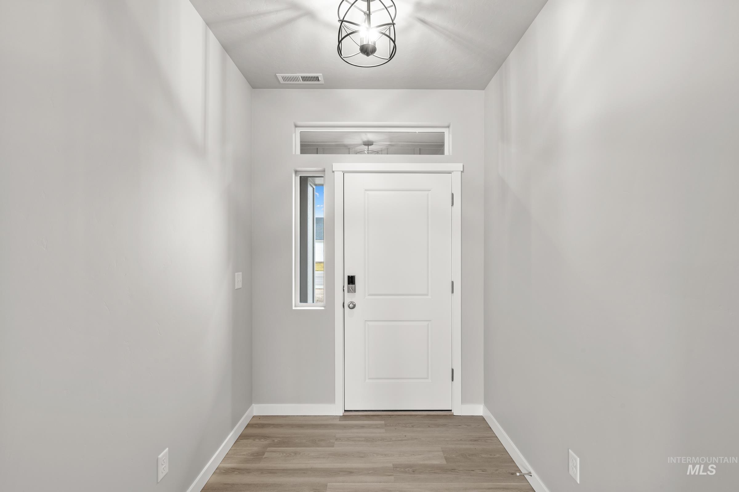 487 Hamlow Avenue Middleton, ID 83644 - Photo 2 of 19 Entryway with wood finished floors and baseboards
