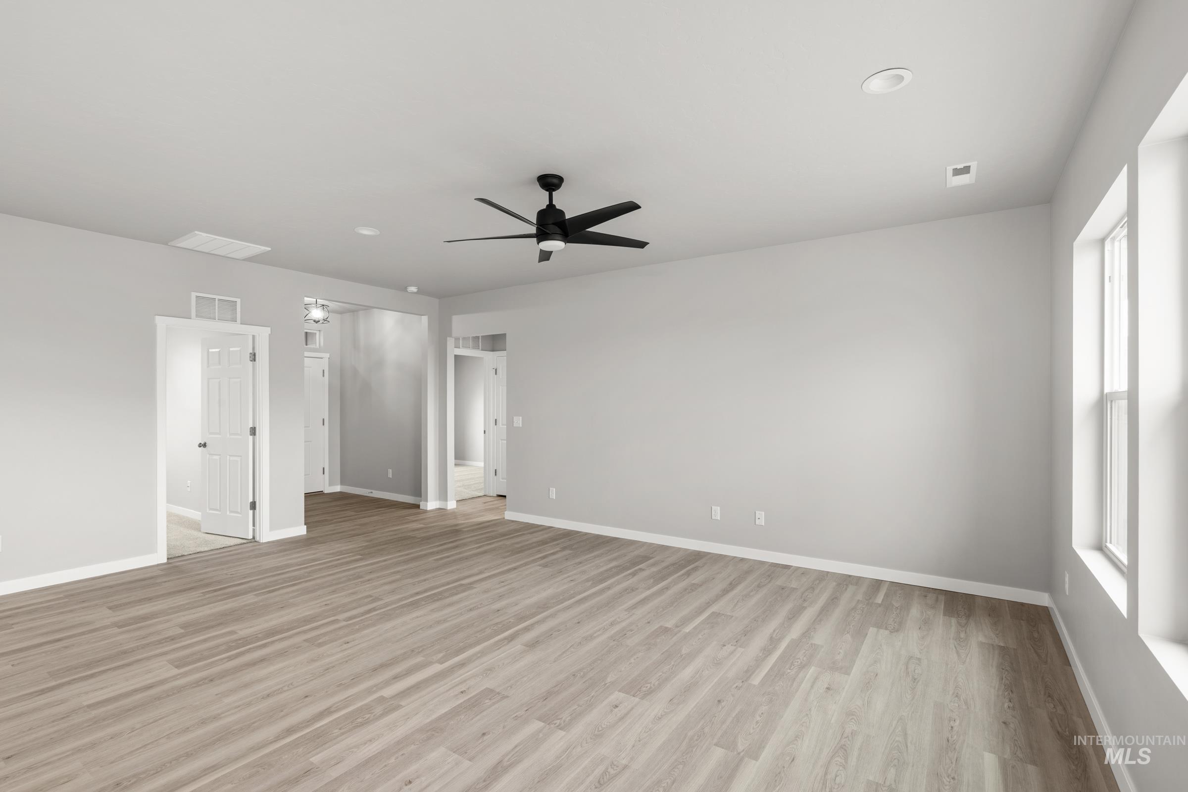 487 Hamlow Avenue Middleton, ID 83644 - Photo 7 of 19 Unfurnished room with ceiling fan, light wood-style flooring, and recessed lighting