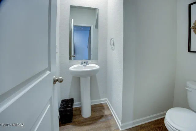 a bathroom with a sink and toilet