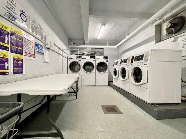 a bathroom with a shower and a glass door