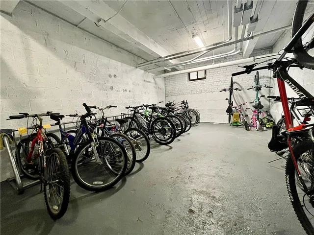 a view of a garage with cars