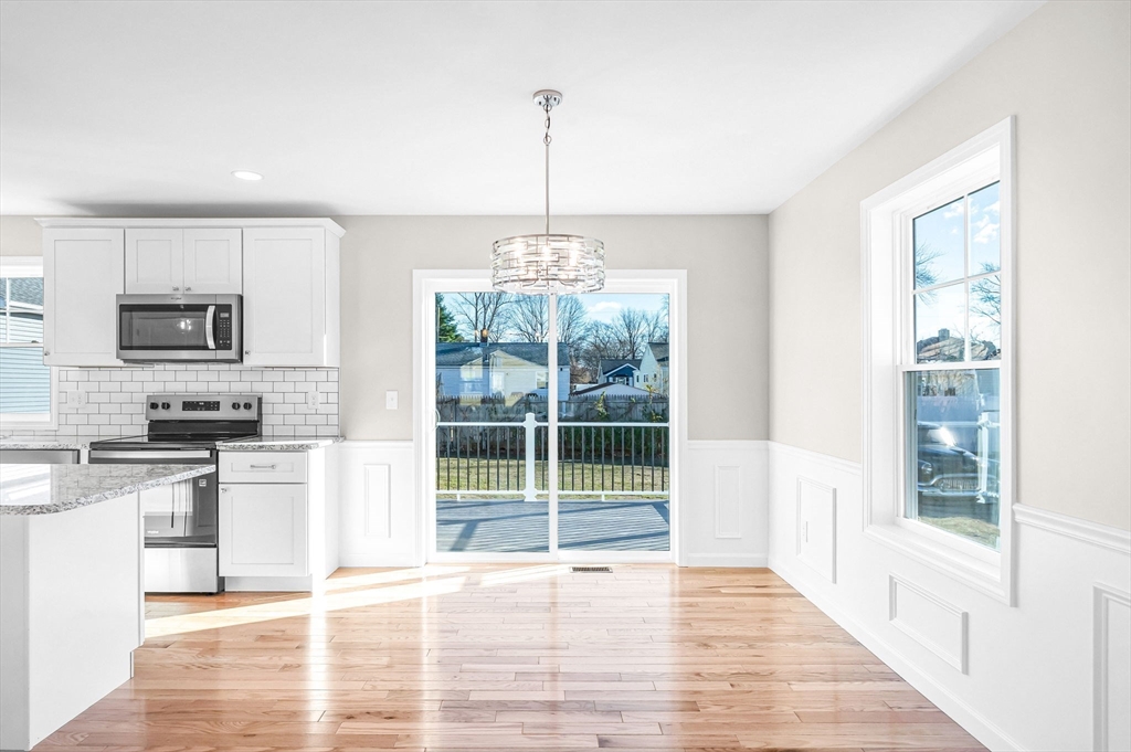 39 Wallace Street Springfield, MA 01119 - Photo 12 of 41 a kitchen with stainless steel appliances granite countertop a stove top oven a sink a counter space and cabinets