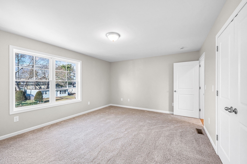 39 Wallace Street Springfield, MA 01119 - Photo 29 of 41 a view of an empty room with a window