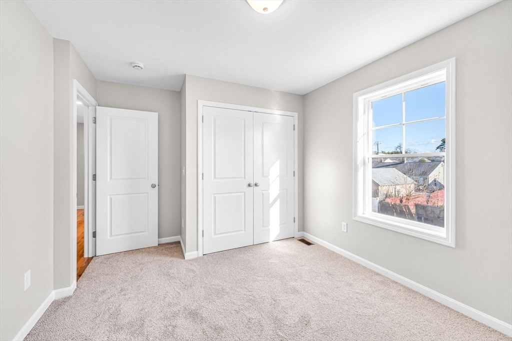 39 Wallace Street Springfield, MA 01119 - Photo 30 of 41 an empty room with painting on the wall