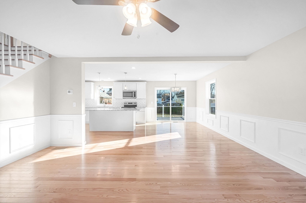 39 Wallace Street Springfield, MA 01119 - Photo 6 of 41 a view of an empty room with wooden floor and a window
