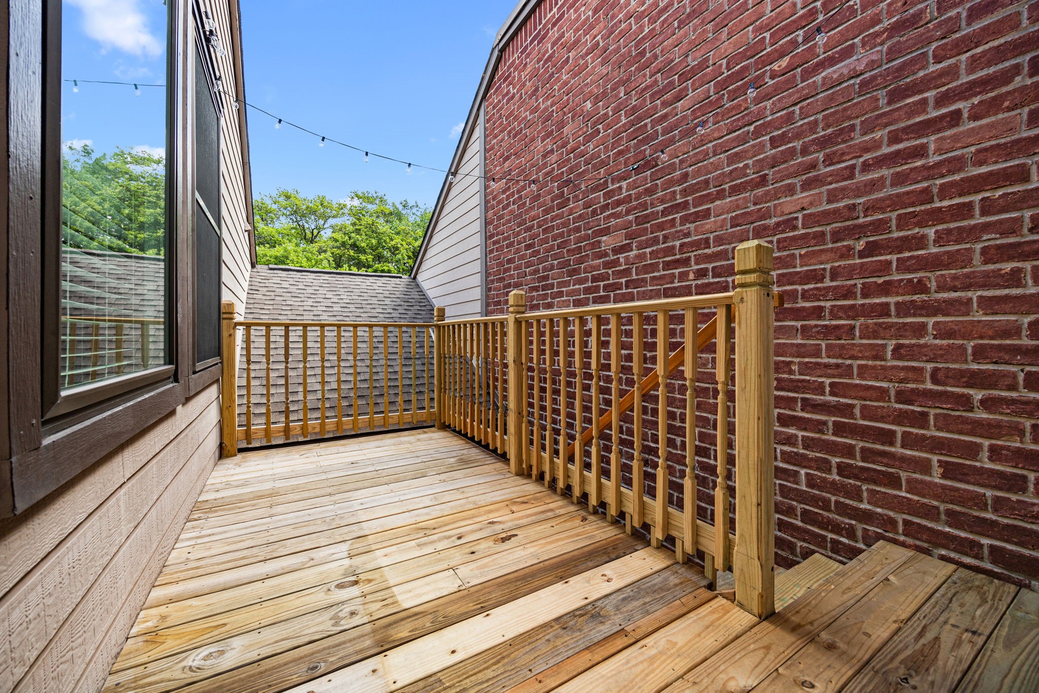 7447 Cambridge Street, Unit 117 Houston, TX 77054 - Photo 22 of 38 a view of wooden balcony