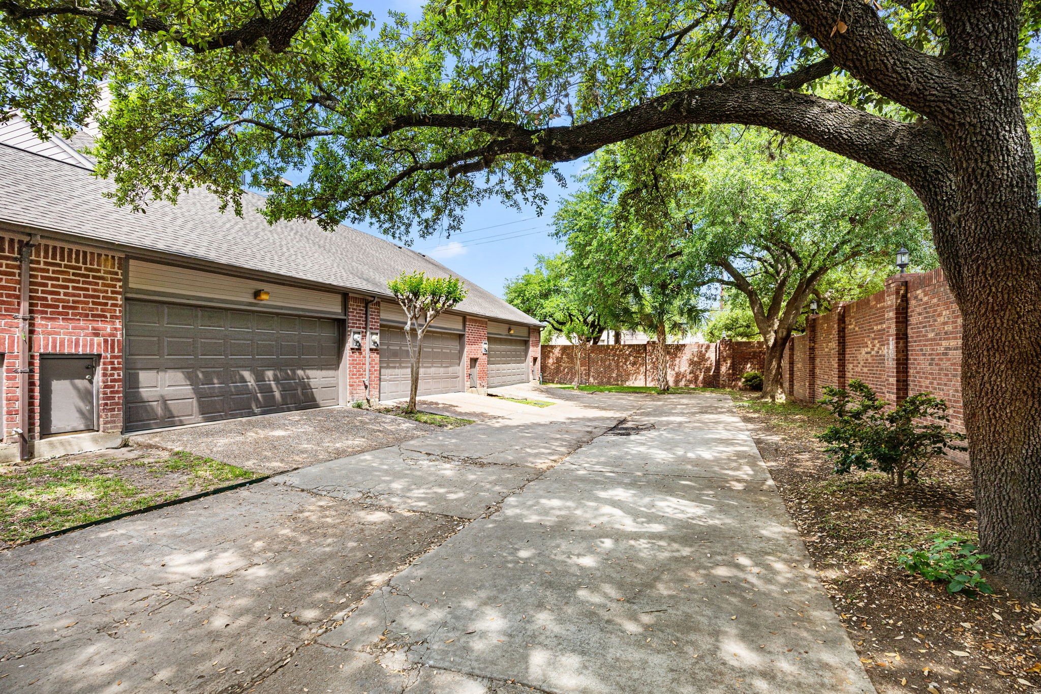 7447 Cambridge Street, Unit 117 Houston, TX 77054 - Photo 26 of 38 a front view of a house with a garden