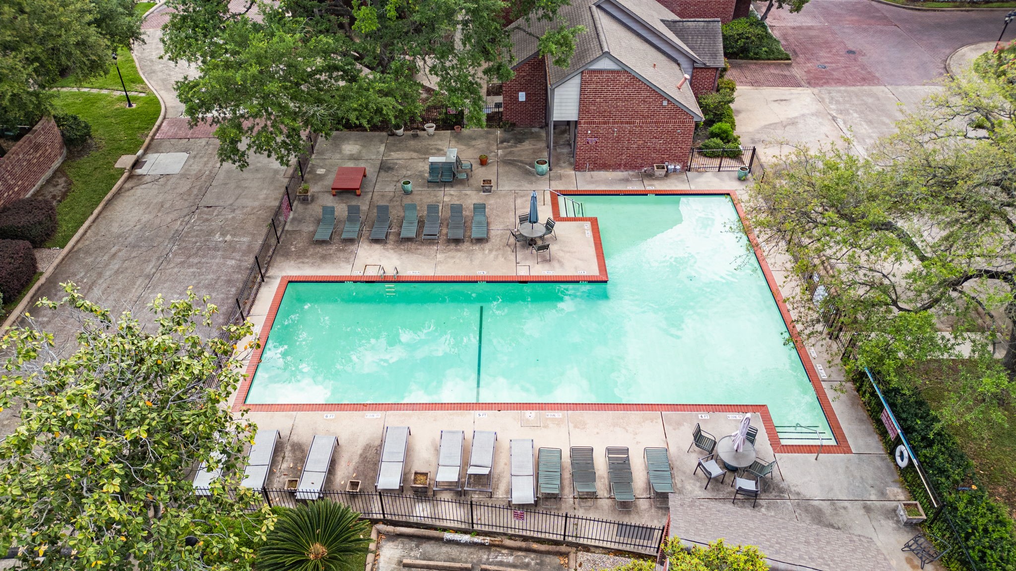 7447 Cambridge Street, Unit 117 Houston, TX 77054 - Photo 28 of 38 an aerial view of a house with garden space and street view