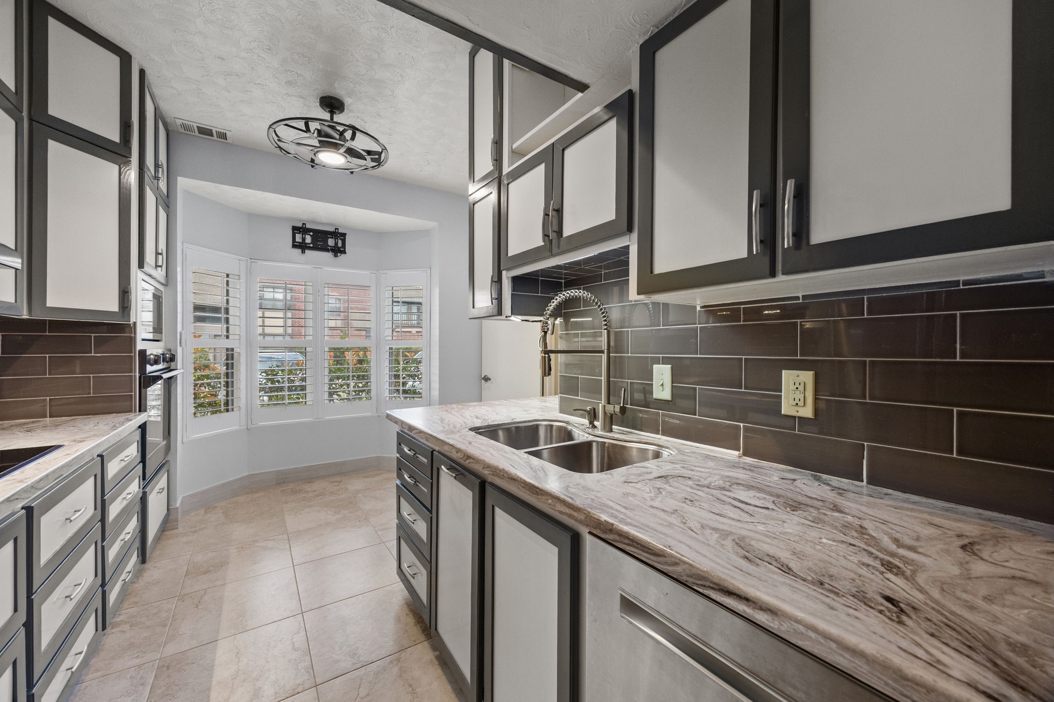 7447 Cambridge Street, Unit 117 Houston, TX 77054 - Photo 5 of 38 a kitchen with a sink and cabinets
