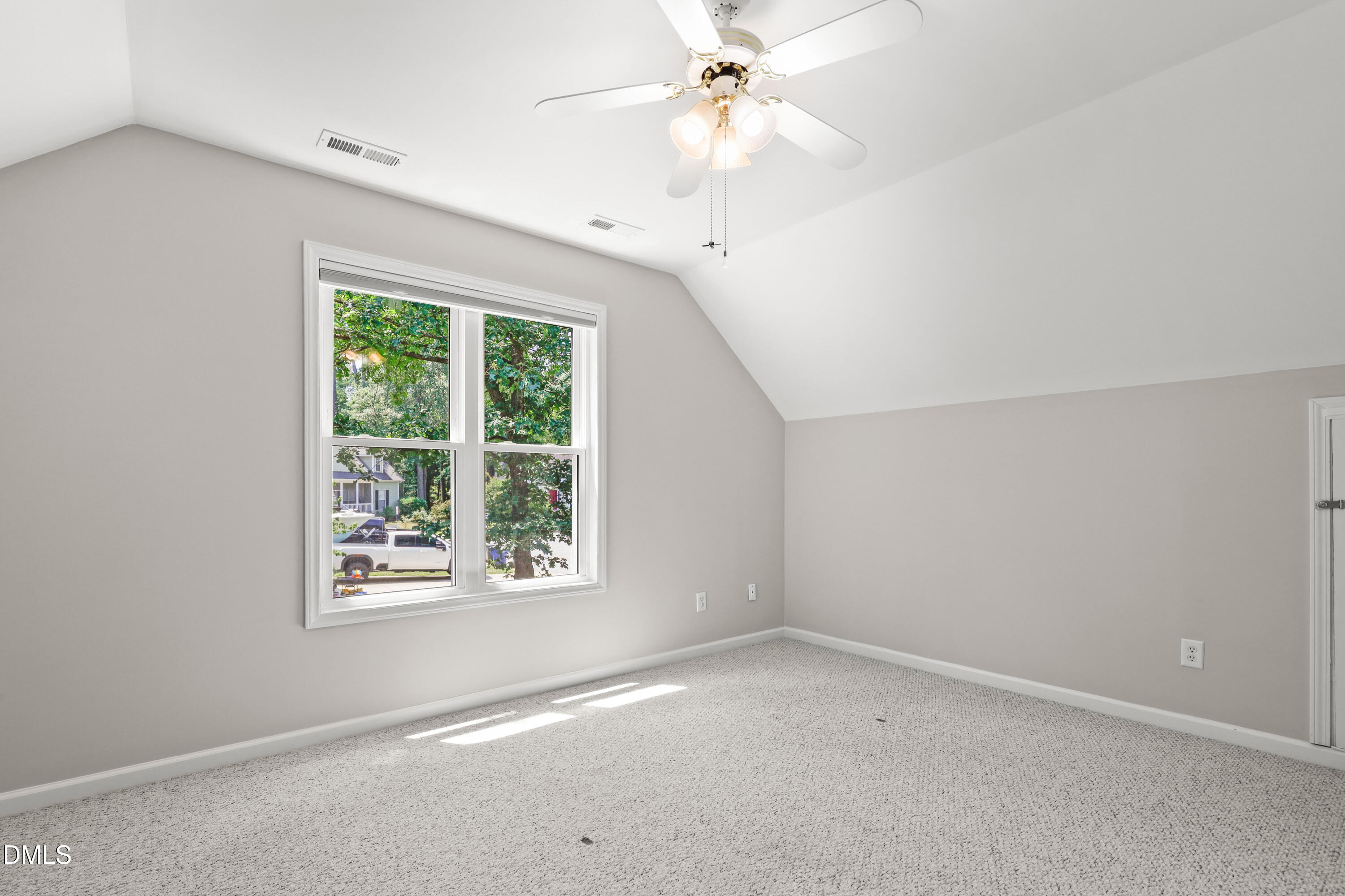 3015 Rennit Court Raleigh, NC 27603 - Photo 29 of 40 an empty room with a window and a fan