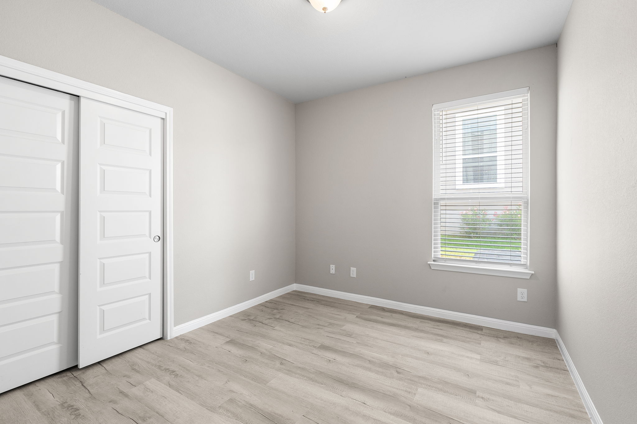 313 Mclintock Road Jarrell, TX 76537 - Photo 9 of 40 A well-lit room featuring durable flooring and a window offering natural light.