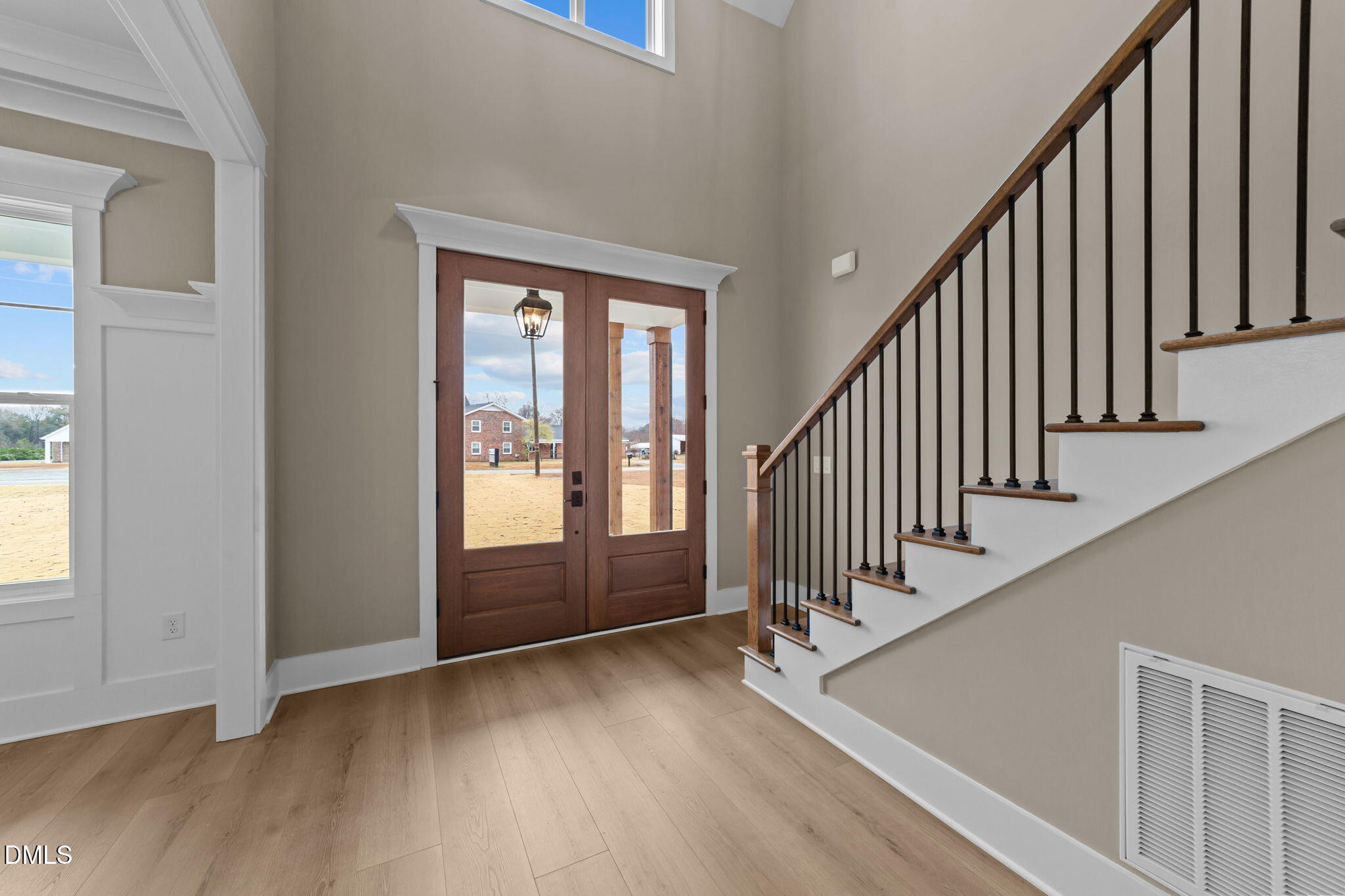 2590 Lassiter Road Four Oaks, NC 27524 - Photo 7 of 72 a view of an entryway with wooden floor and door