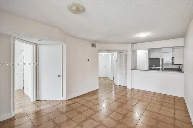 a view of a kitchen with a sink