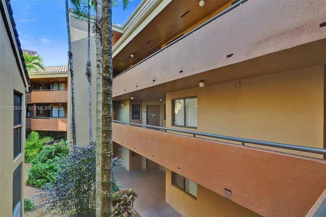 a view of a house with a wooden fence