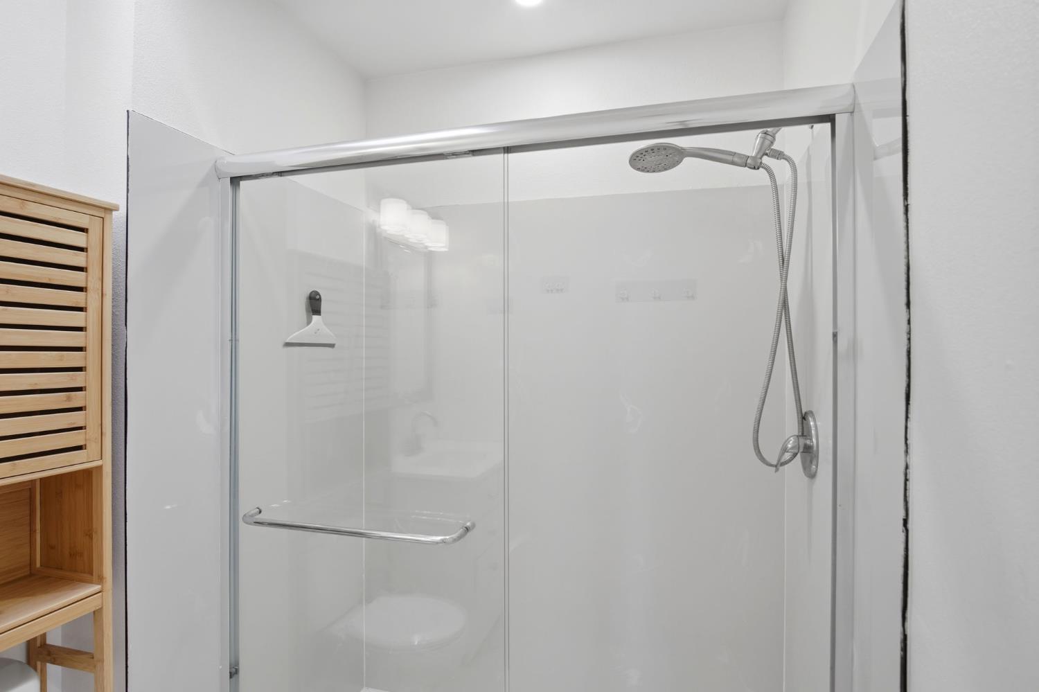 680 Sherri Way Turlock, CA 95382 - Photo 19 of 35 a bathroom with a glass shower door