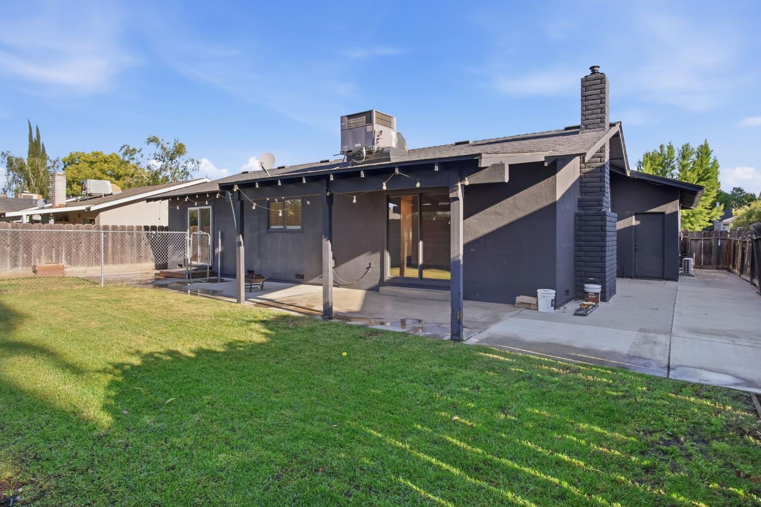 680 Sherri Way Turlock, CA 95382 - Photo 23 of 35 a view of a backyard with a garden and deck
