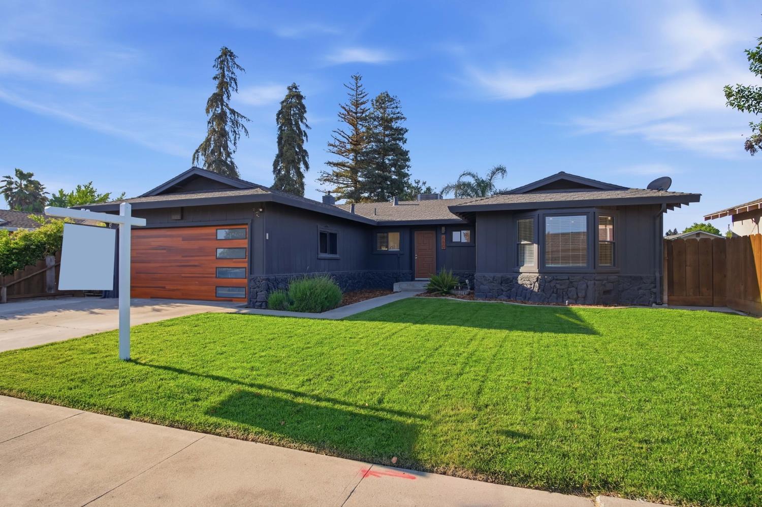 680 Sherri Way Turlock, CA 95382 - Photo 25 of 35 a front view of a house with garden