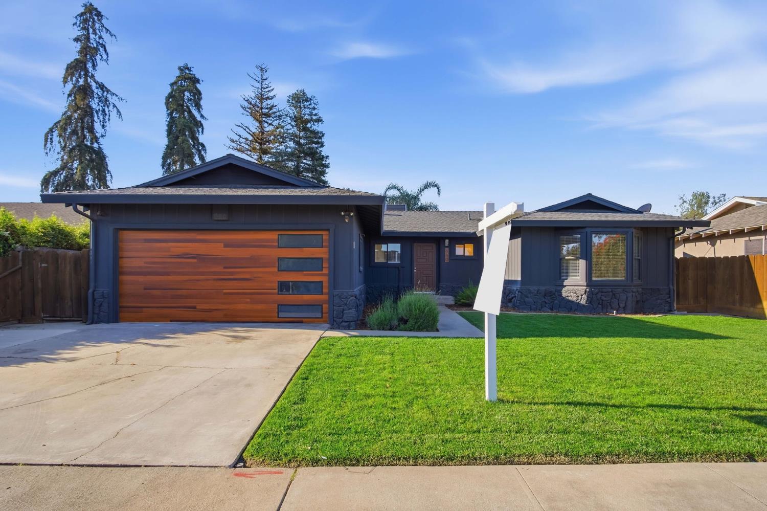 680 Sherri Way Turlock, CA 95382 - Photo 26 of 35 a front view of a house with garden