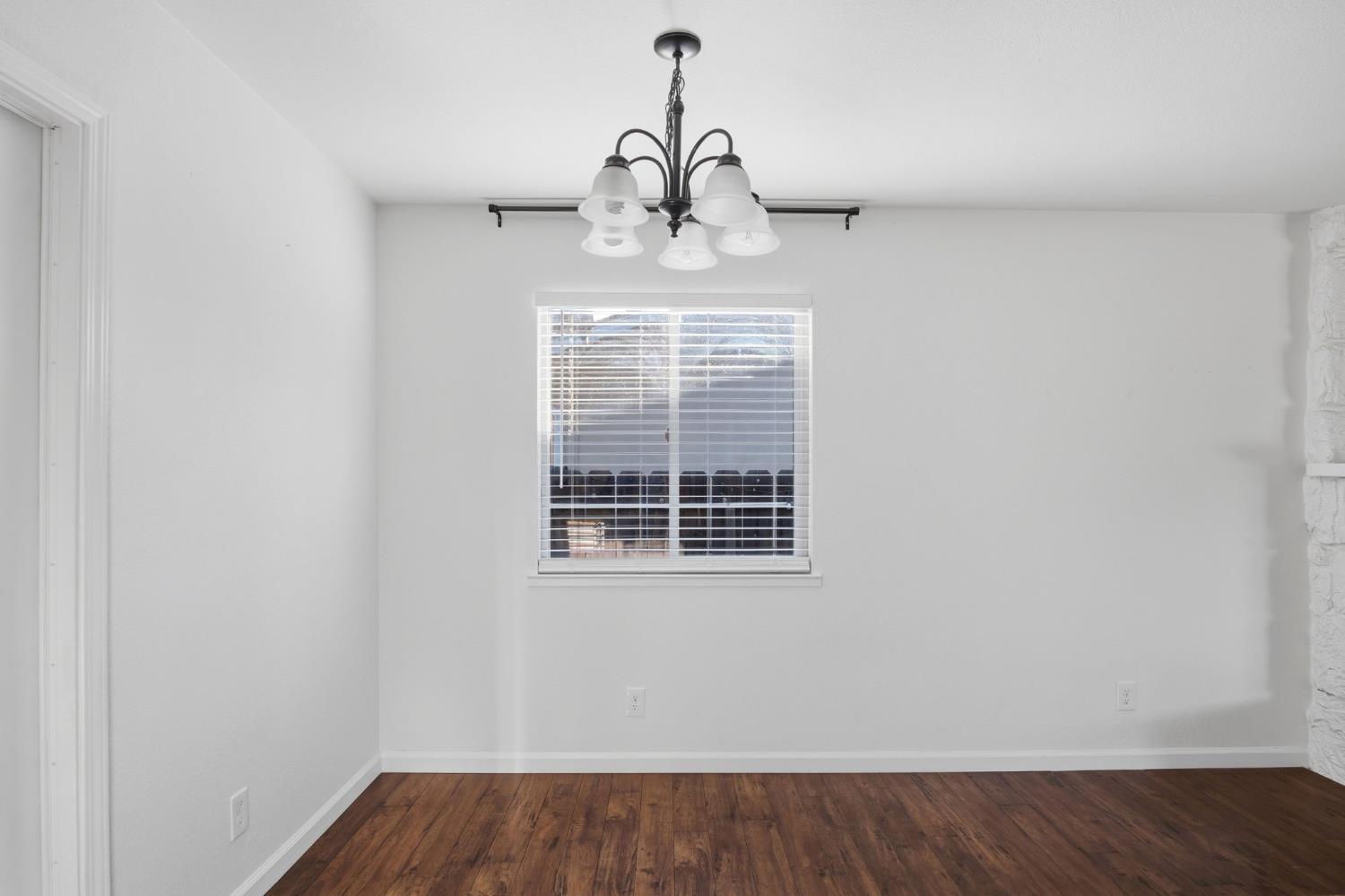 680 Sherri Way Turlock, CA 95382 - Photo 5 of 35 a view of wooden floor and windows in a room