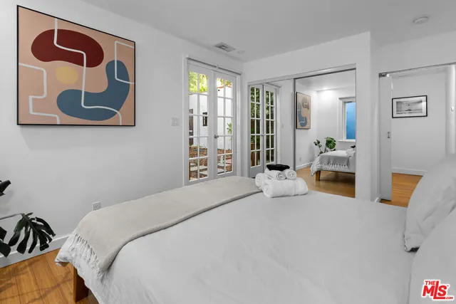 a bedroom with a bed and a couch