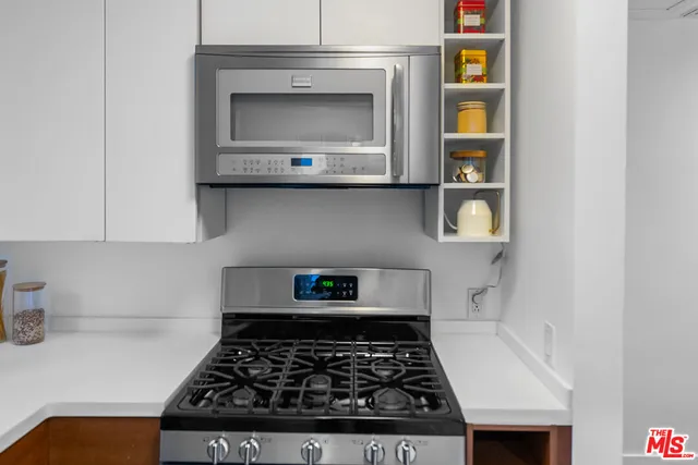 a kitchen with a stove and a microwave