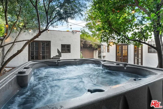 a view of a bench in the backyard