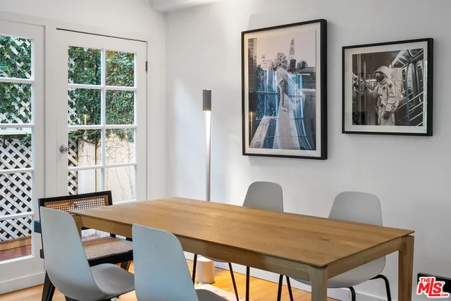 a view of a dining room with furniture wooden floor and a window