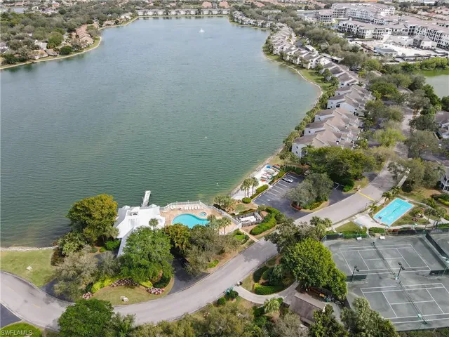 an aerial view of a house with a lake view