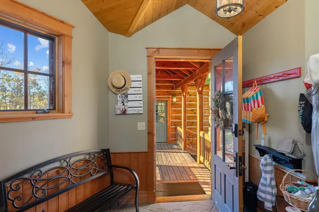 a living room with furniture and fireplace