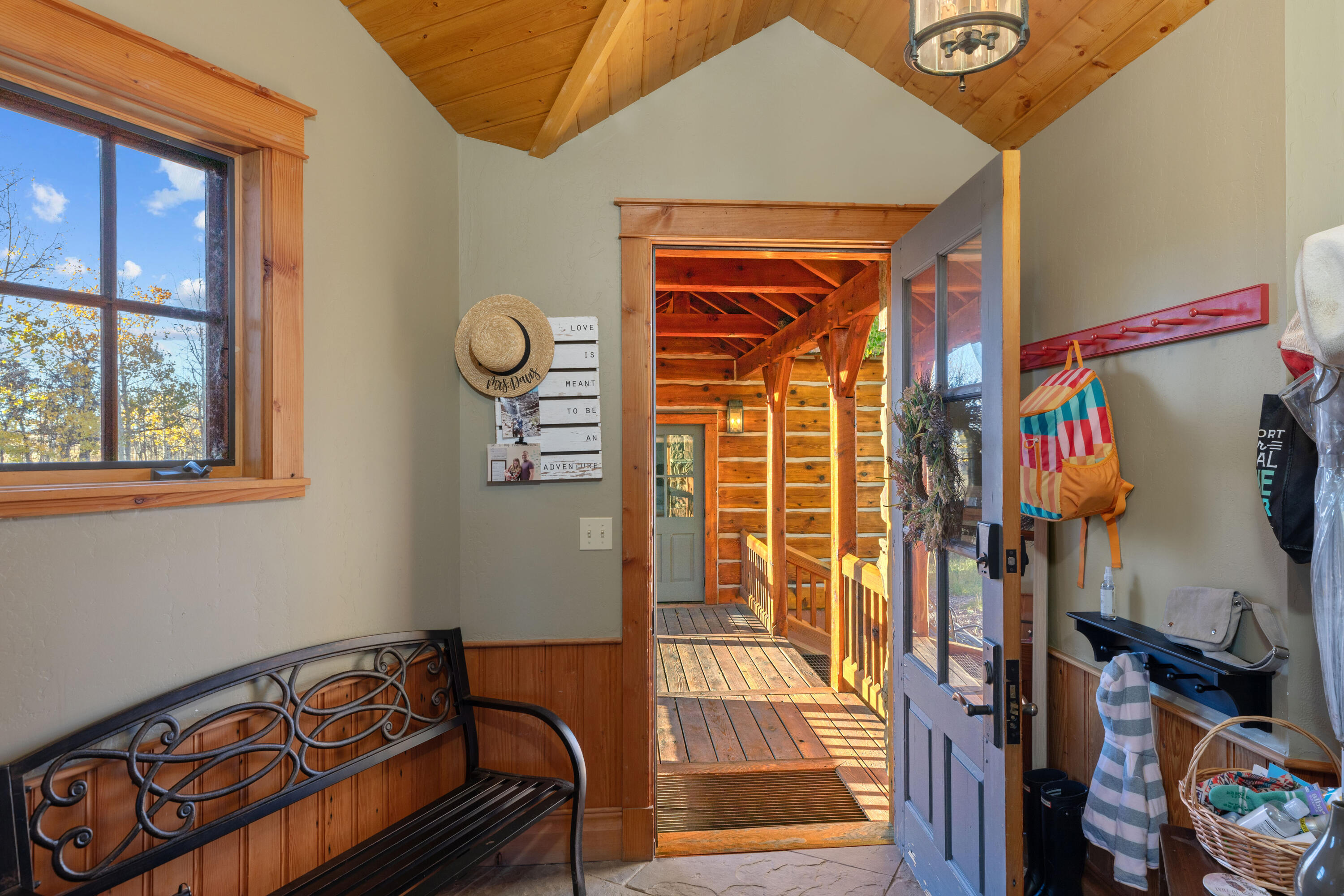 1036 Harcourt Trail Placerville, CO 81430 - Photo 26 of 44 a front view of a house with entryway