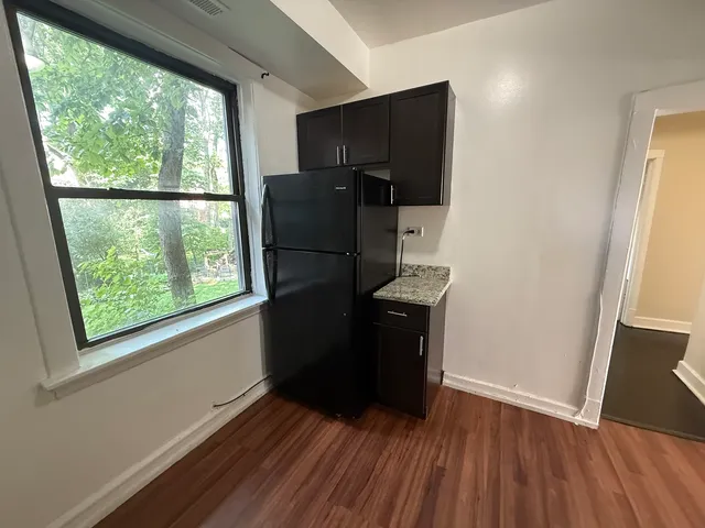 a view of a kitchen from a hallway
