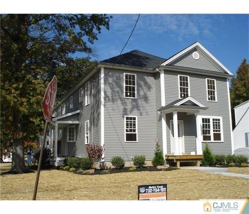 52 West Cliff Road Colonia, NJ 07067 - Photo 2 of 18 a front view of a house with a yard