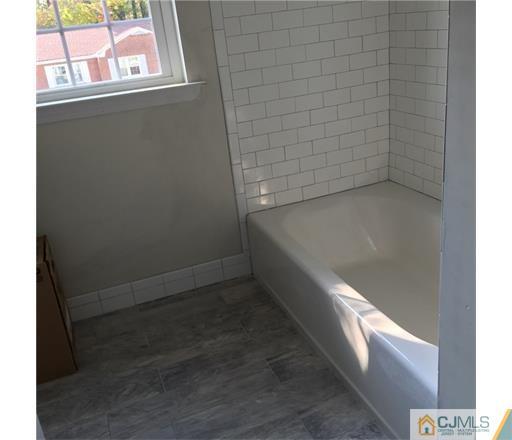 52 West Cliff Road Colonia, NJ 07067 - Photo 11 of 18 a bathroom with a bathtub