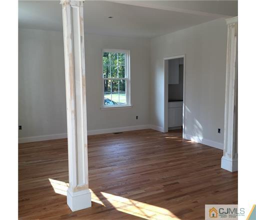 52 West Cliff Road Colonia, NJ 07067 - Photo 9 of 18 a view of wooden floor in an empty room