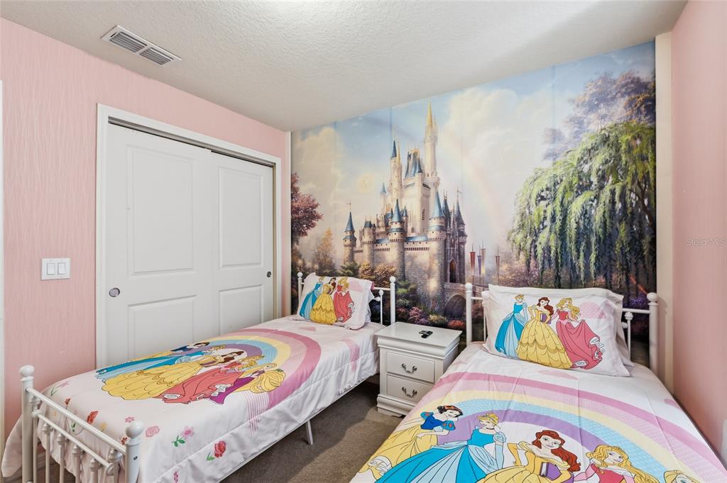 236 Jetty Way Davenport, FL 33897 - Photo 12 of 25 a bedroom with bed and a bed