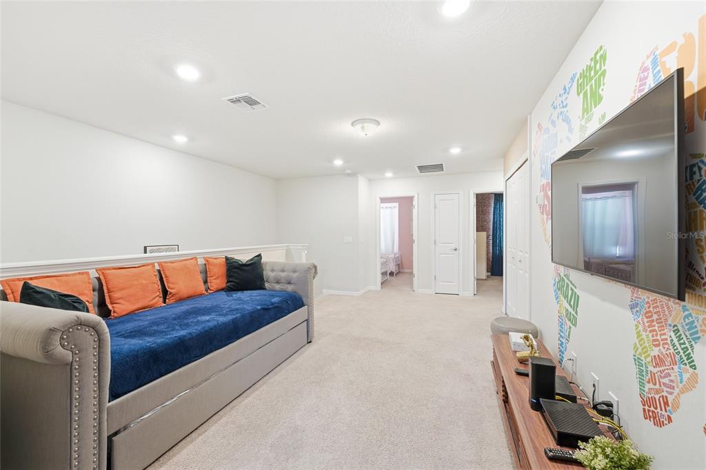 236 Jetty Way Davenport, FL 33897 - Photo 19 of 25 a living room with furniture and a couch