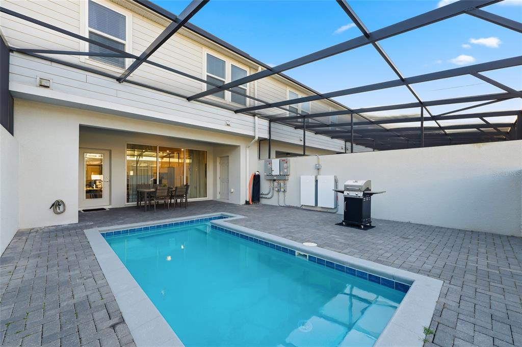 236 Jetty Way Davenport, FL 33897 - Photo 25 of 25 a view of an outdoor space with pool and windows