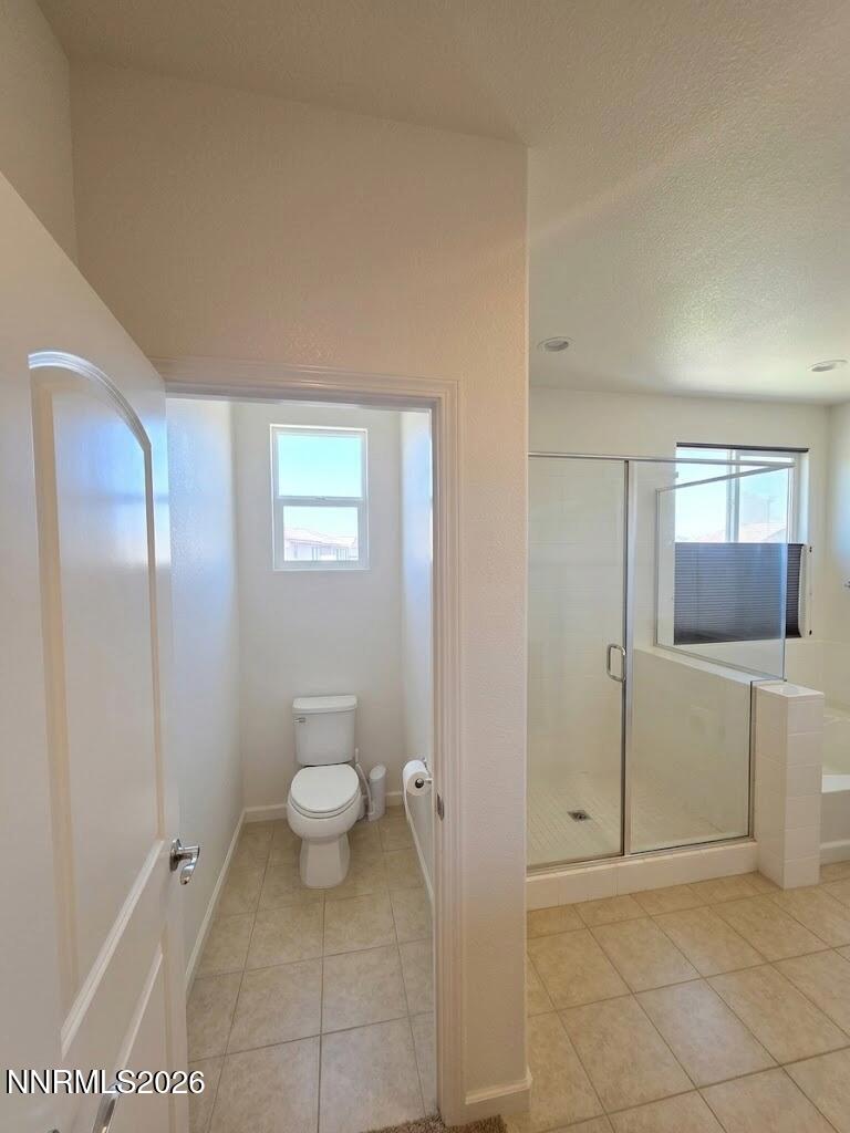 2775 Bonfire Lane Reno, NV 89521 - Photo 25 of 41 a bathroom with a granite countertop sink a toilet and shower