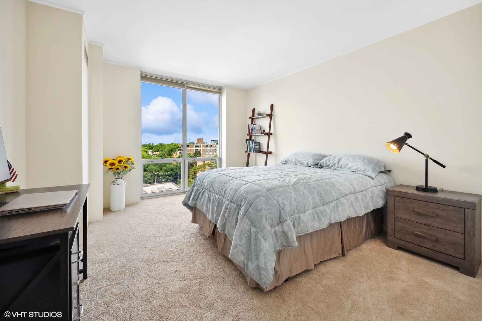 1640 Maple Avenue, Unit 704 Evanston, IL 60201 - Photo 14 of 15 a bedroom with a bed dresser and a window