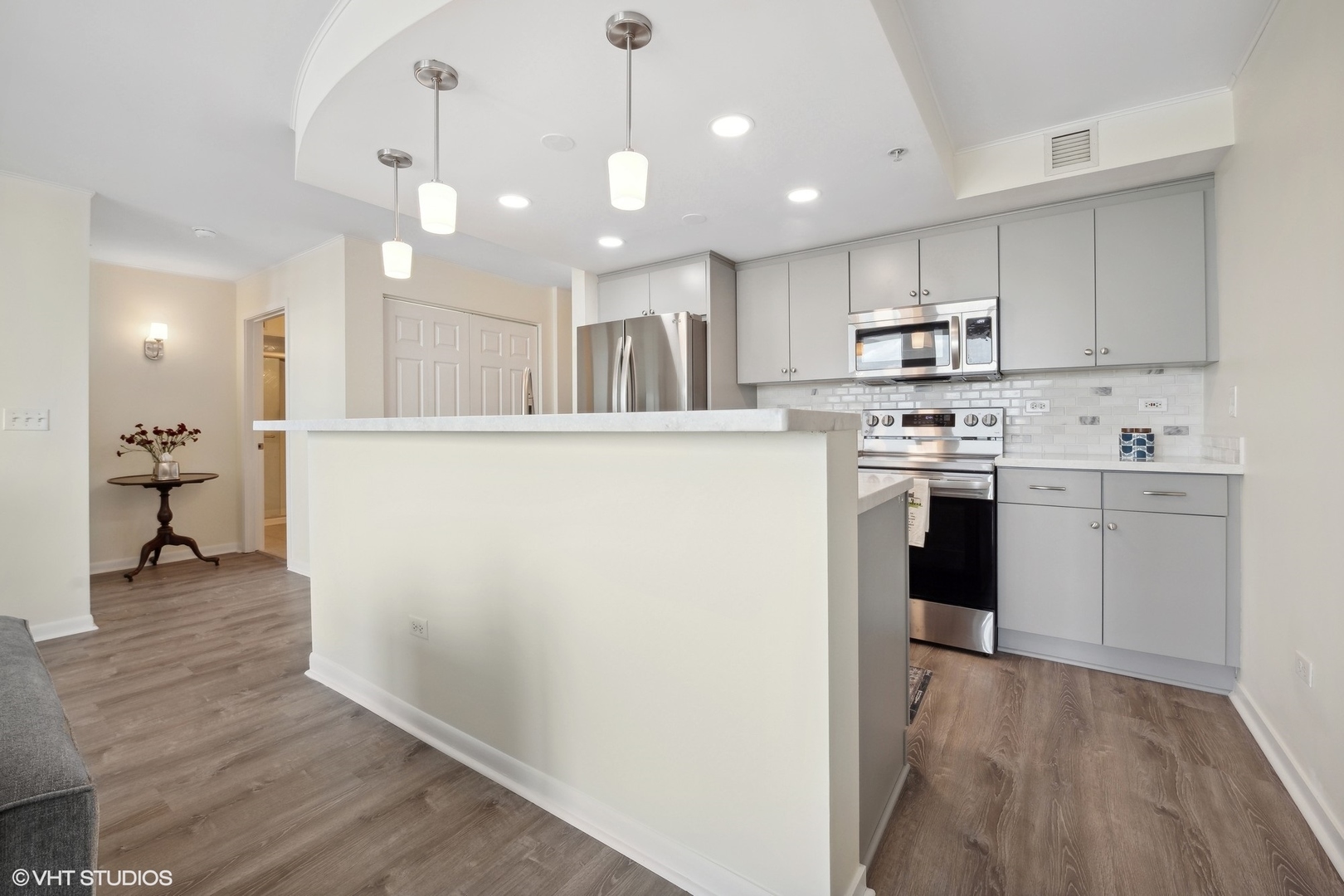 1640 Maple Avenue, Unit 704 Evanston, IL 60201 - Photo 6 of 15 a view of kitchen with wooden floor