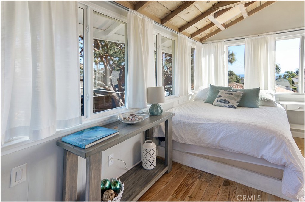 34556 Calle Naranja, Unit A Dana Point, CA 92624 - Photo 5 of 12 a bedroom with a bed and a window