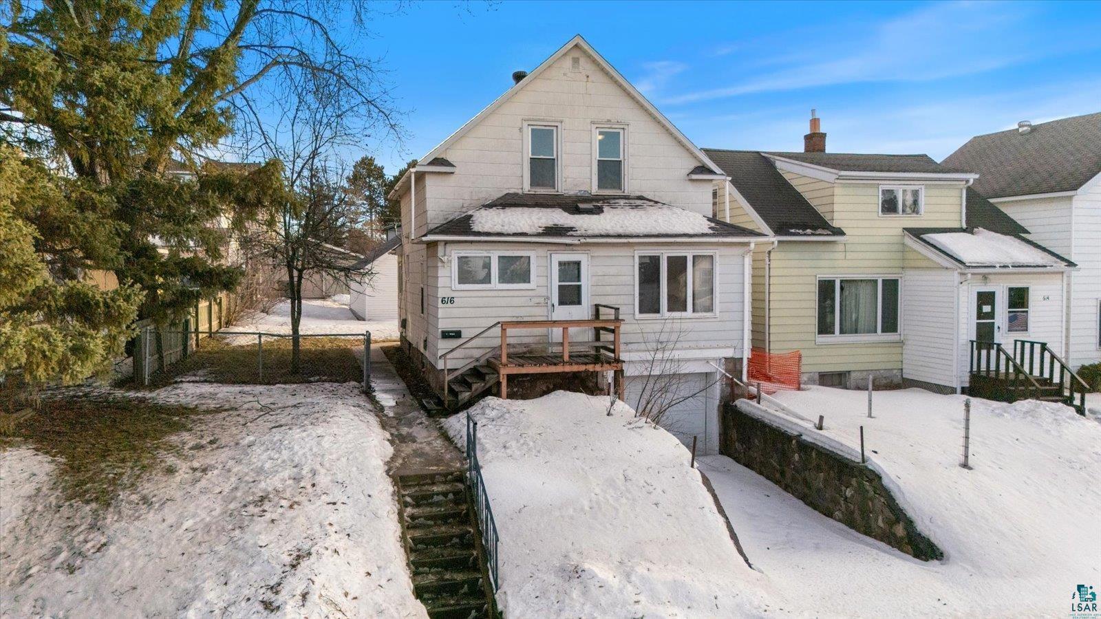 616 Summit Street Eveleth, MN 55734 - Photo 2 of 42 Snow covered property with a chimney