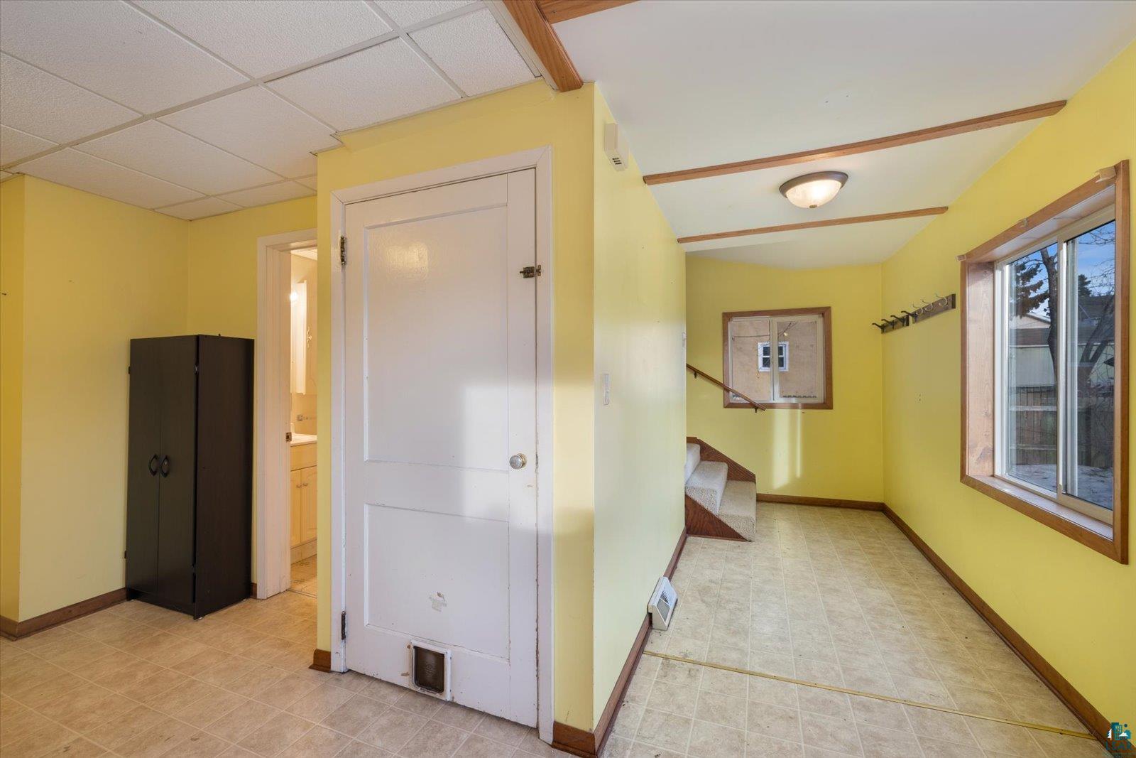 616 Summit Street Eveleth, MN 55734 - Photo 10 of 42 Corridor with baseboards and a drop ceiling