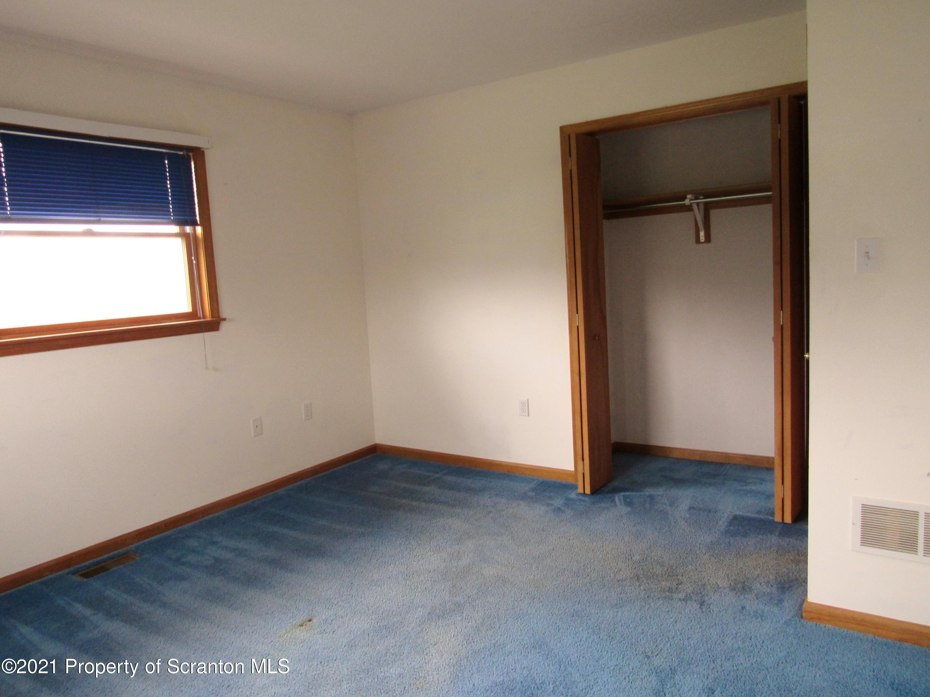 336 Aukema Road Meshoppen, PA 18630 - Photo 44 of 67 an empty room with closet and a window