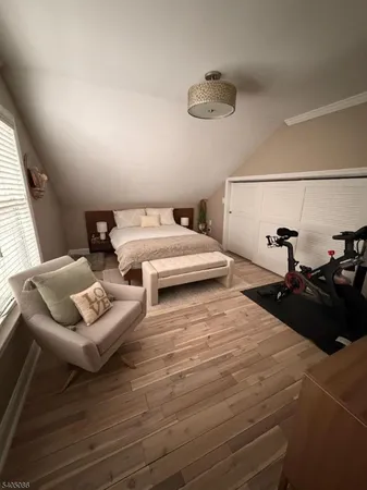 a bedroom with bed and a couch